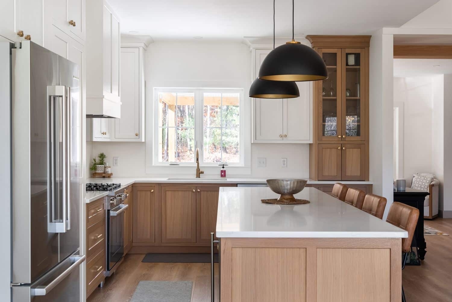 Transitional two-tone kitchen with white upper cabinets and natural white oak lower cabinets